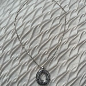 Necklace with large pendant.